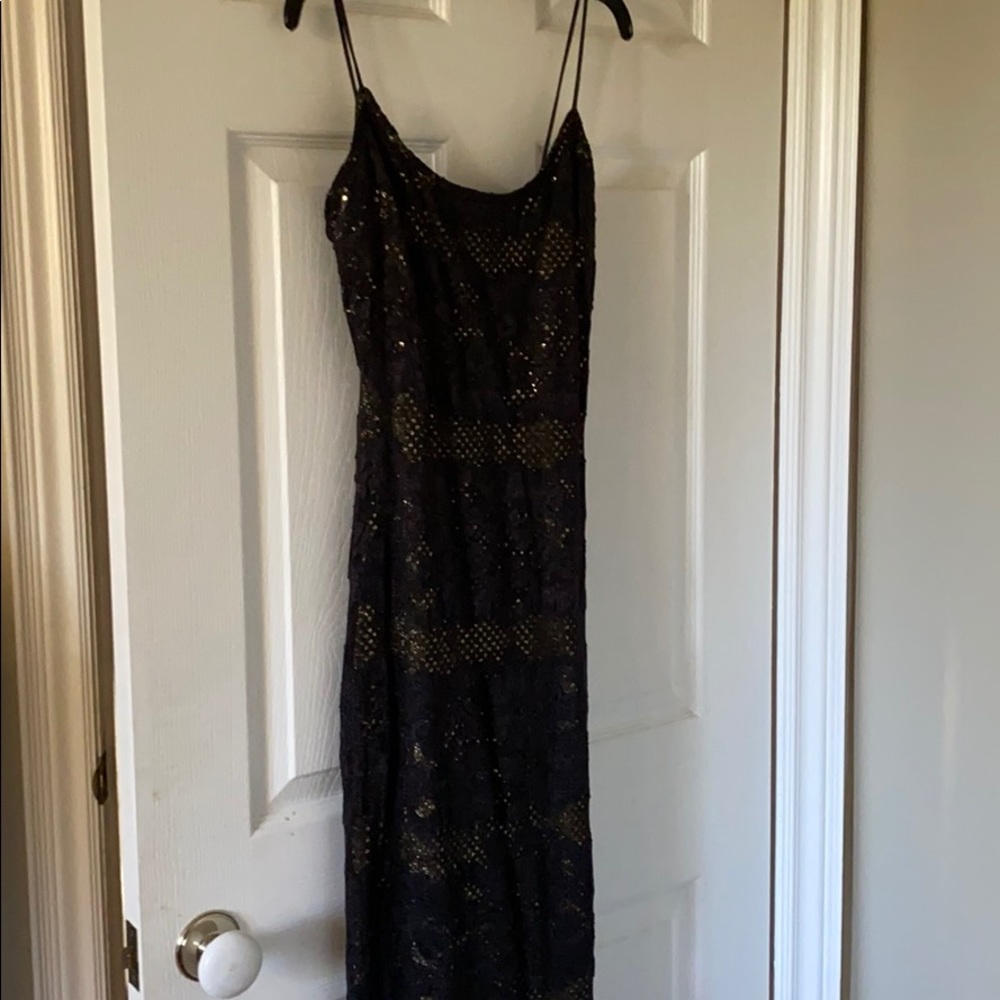 Black and gold evening dress with a bit of a tail